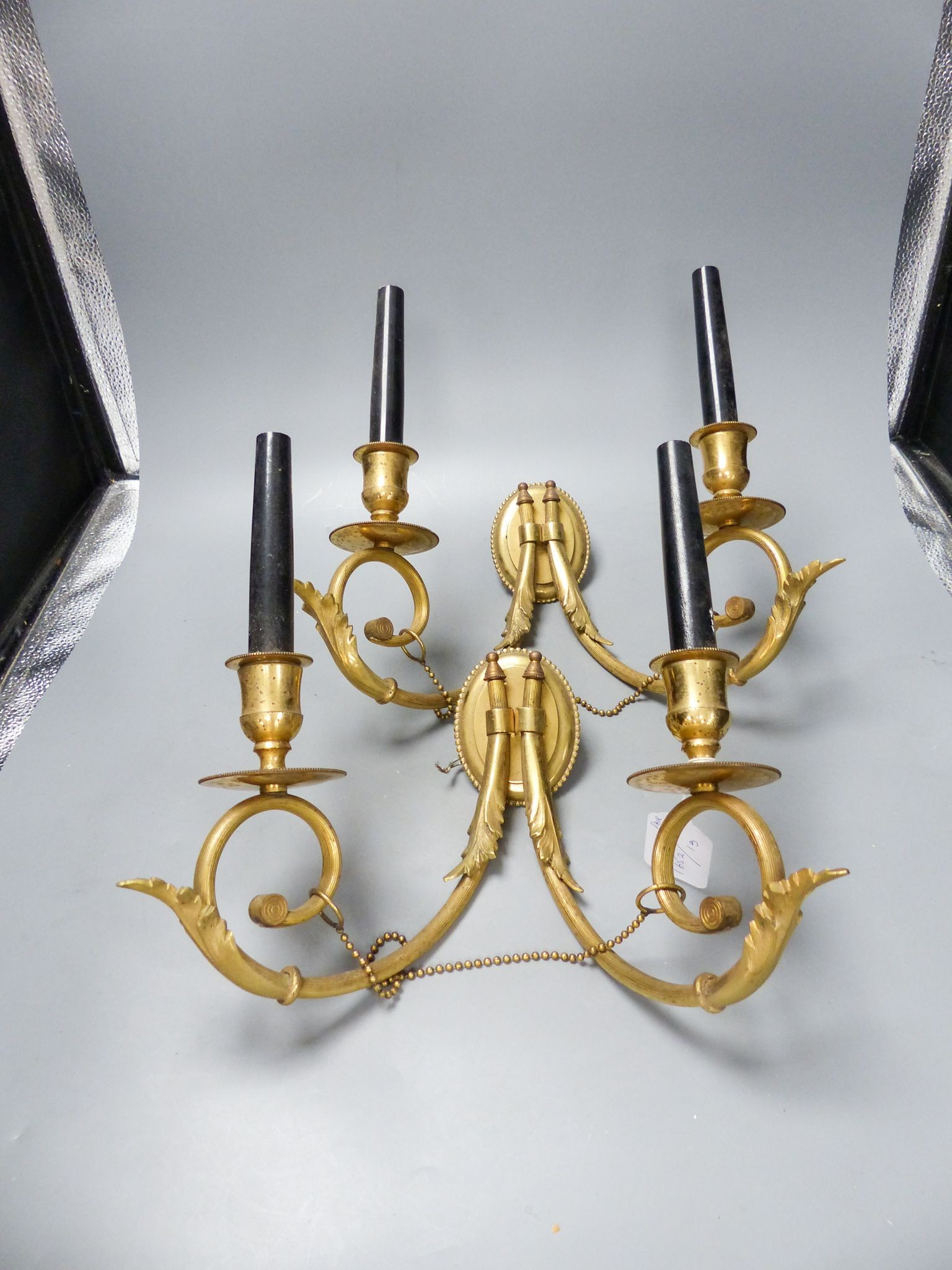 A pair of twin branch gilt metal sconces, 27.5 cm